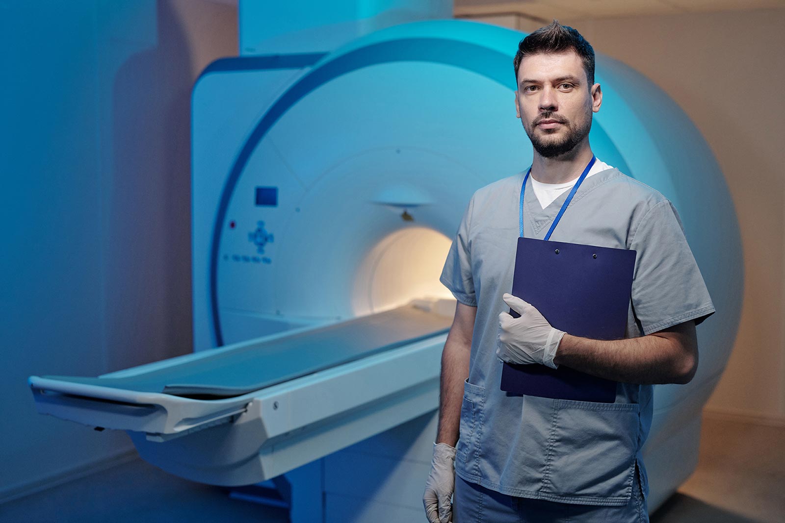 Radiologist standing in front of MRI machine