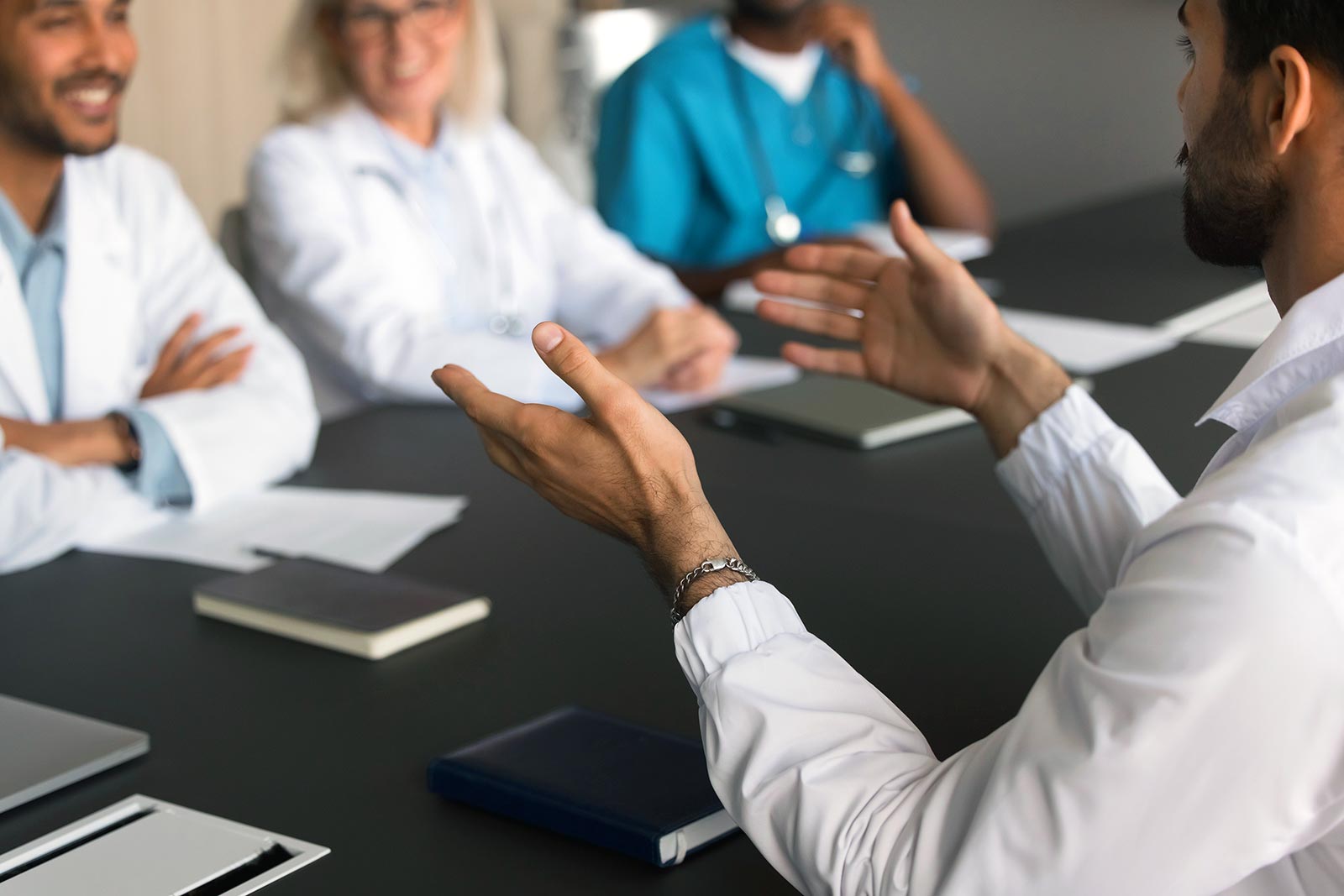 Medical professionals sitting at a conference table